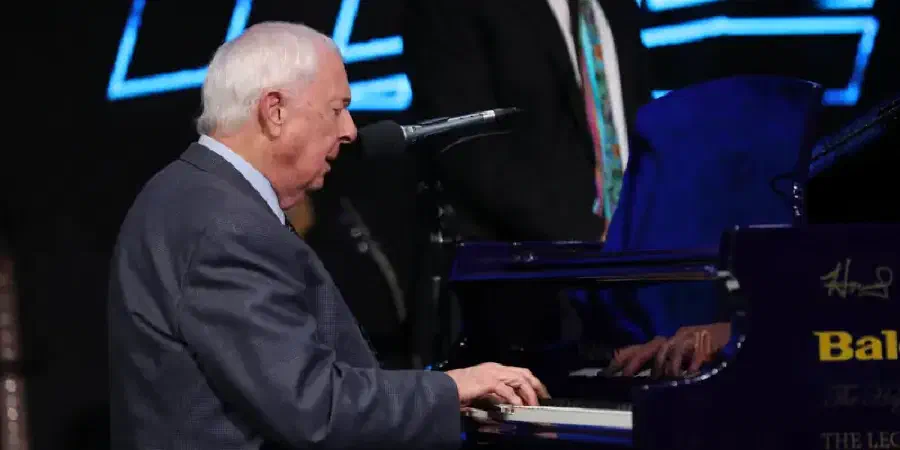 Photo of David Ingles playing a piano