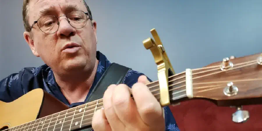 Photo of Jamie Soles playing a guitar